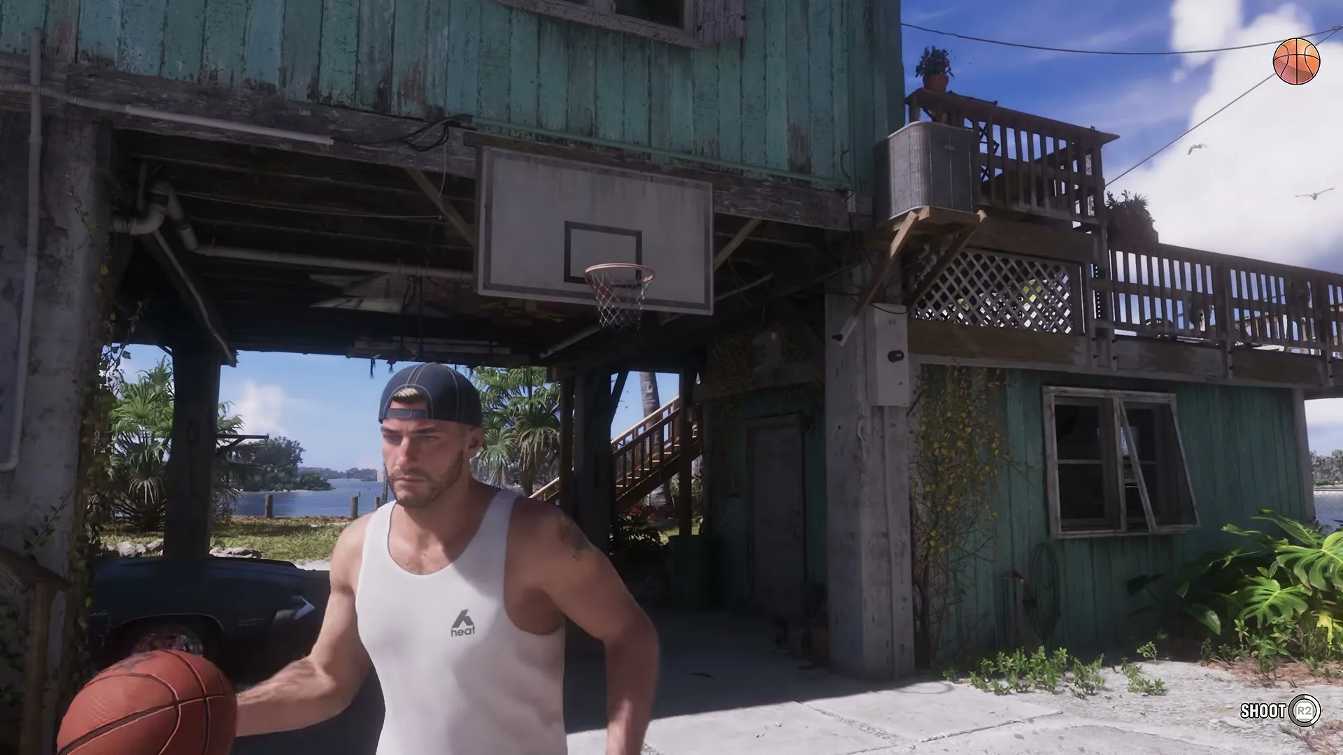 Jason dribbling a basketball under the hoop at his stilt house in the Keys.