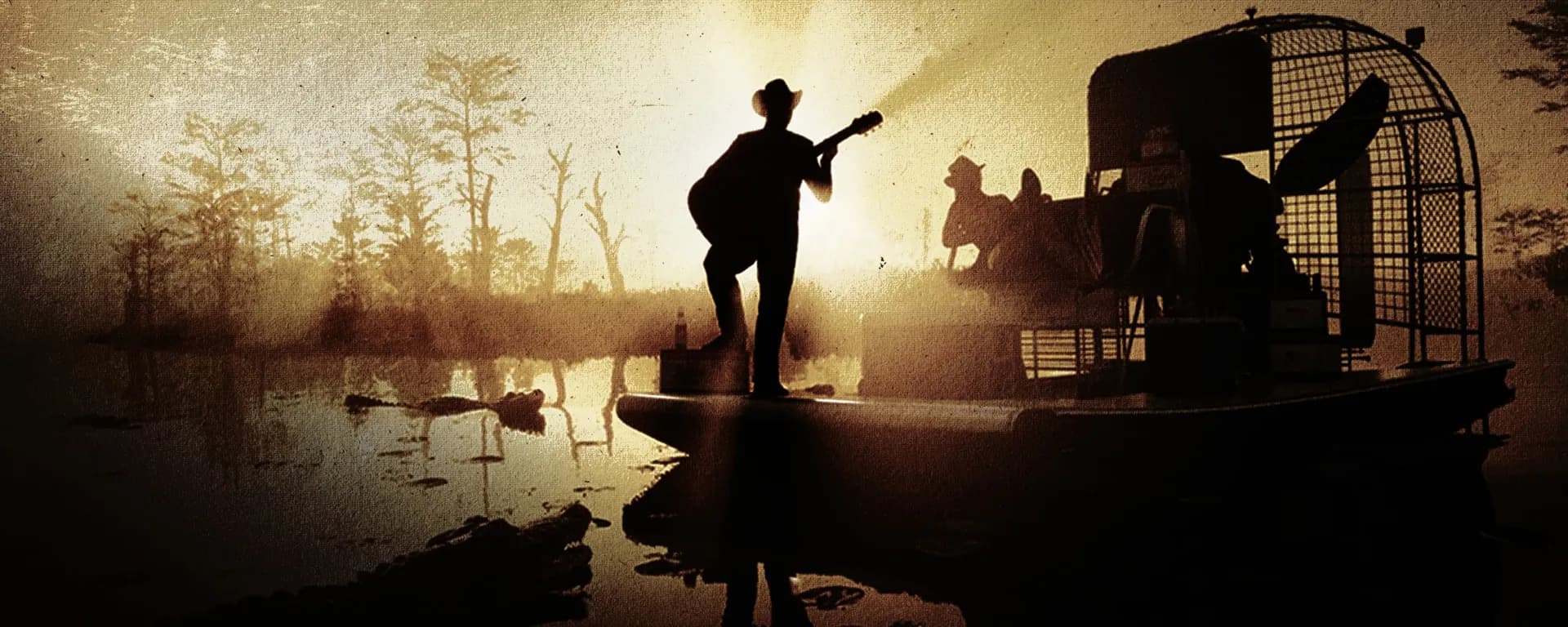 Back Country Radio art: a man in a cowboy hat playing guitar on an airboat in a misty swamp, alligators in the water.